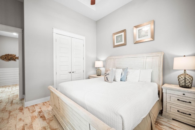 bedroom with a closet, ceiling fan, and light wood-type flooring