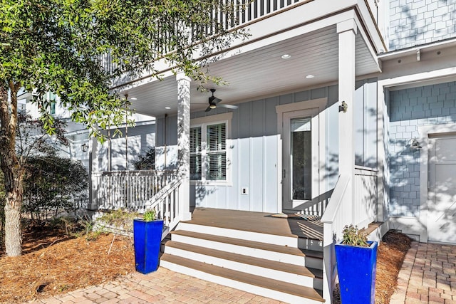 entrance to property with a porch and ceiling fan