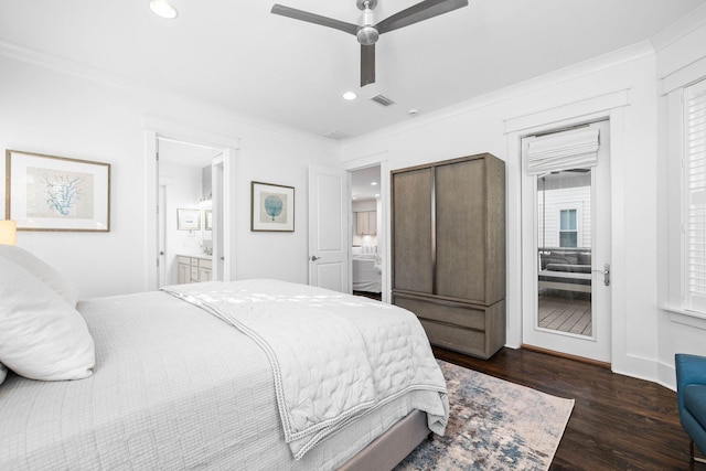 bedroom featuring crown molding, ceiling fan, ensuite bathroom, and dark hardwood / wood-style flooring