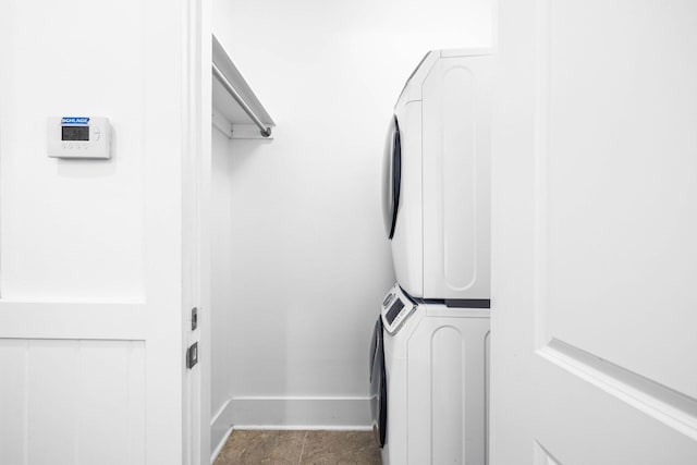 laundry area featuring stacked washer / dryer