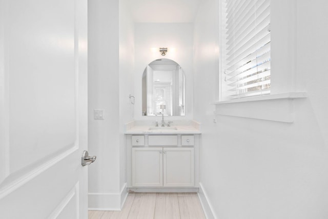 bathroom with vanity and wood-type flooring