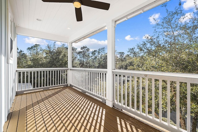 wooden terrace featuring ceiling fan