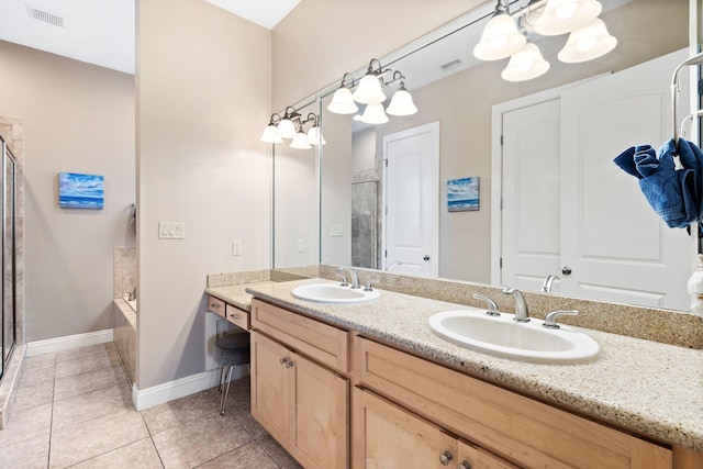 bathroom featuring shower with separate bathtub, tile patterned floors, and vanity