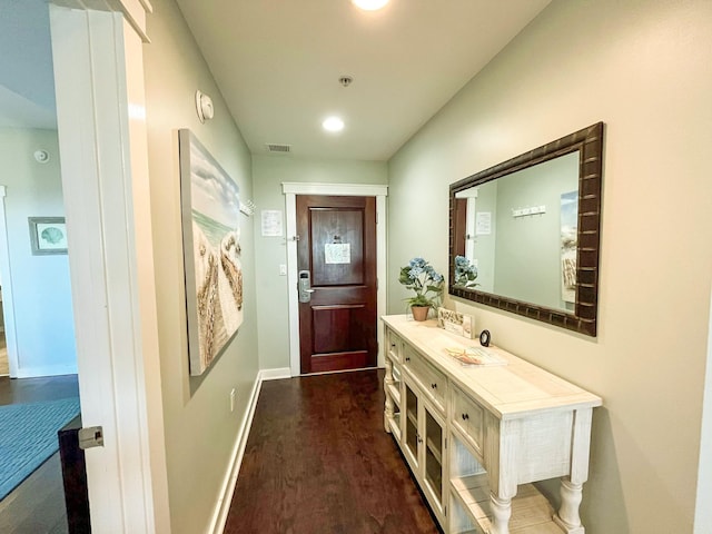 doorway to outside with dark wood-type flooring