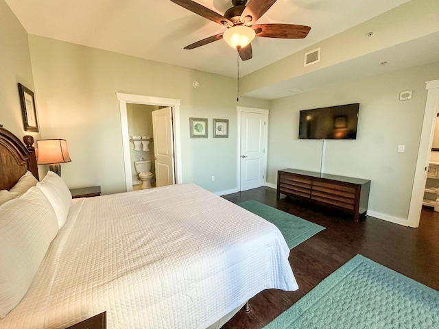 bedroom with connected bathroom, ceiling fan, and dark hardwood / wood-style floors