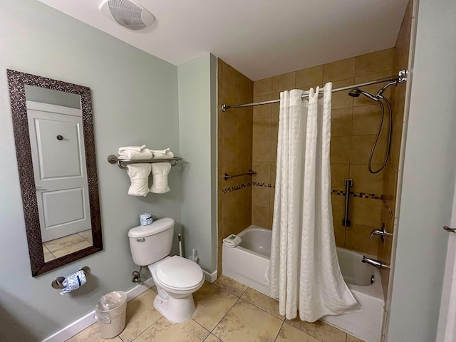 bathroom with toilet, tile patterned flooring, and shower / bath combo with shower curtain