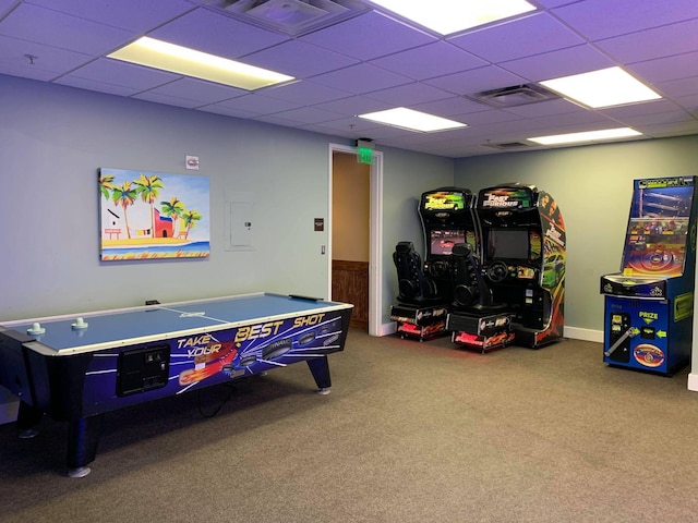 playroom featuring carpet flooring and a drop ceiling