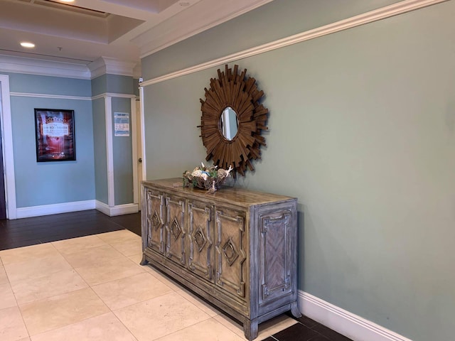 hall featuring ornamental molding and light tile patterned floors