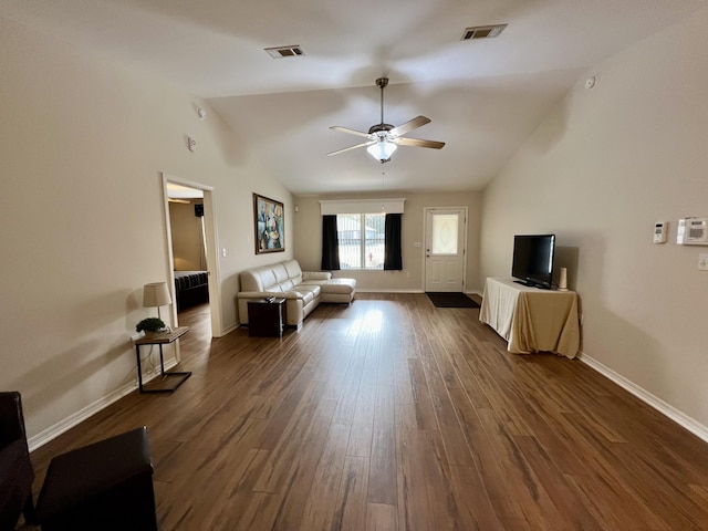 unfurnished living room with ceiling fan, dark wood-type flooring, and vaulted ceiling