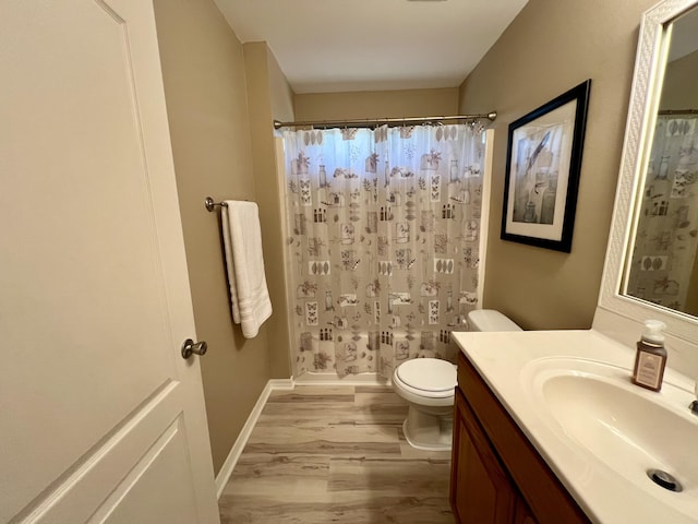 full bathroom with toilet, vanity, shower / bathtub combination with curtain, and hardwood / wood-style floors