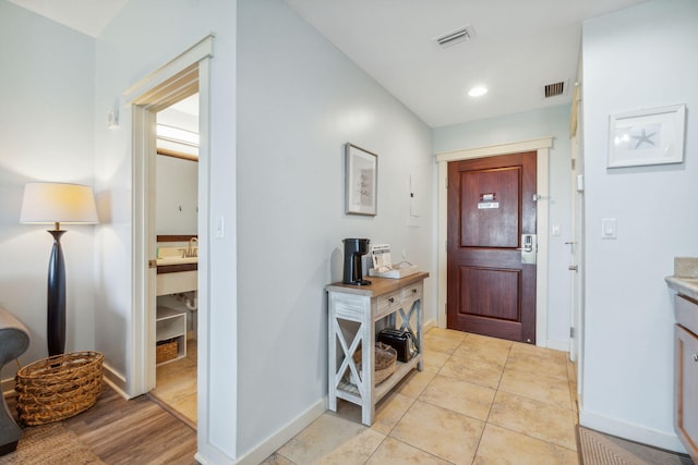 entrance foyer with light tile patterned flooring