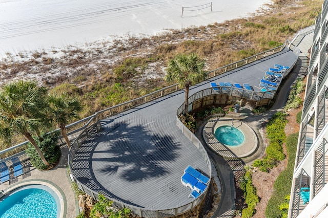 view of swimming pool with a community hot tub