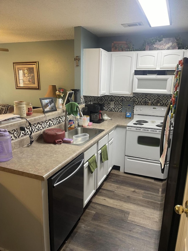 kitchen featuring white appliances, white cabinets, a textured ceiling, dark hardwood / wood-style flooring, and sink