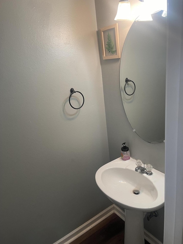 bathroom with sink and hardwood / wood-style floors