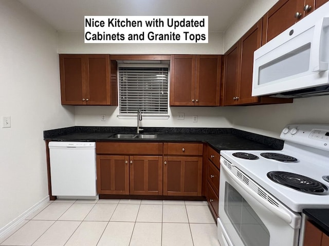 kitchen with sink, white appliances, and light tile patterned floors