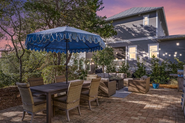 patio terrace at dusk with an outdoor hangout area