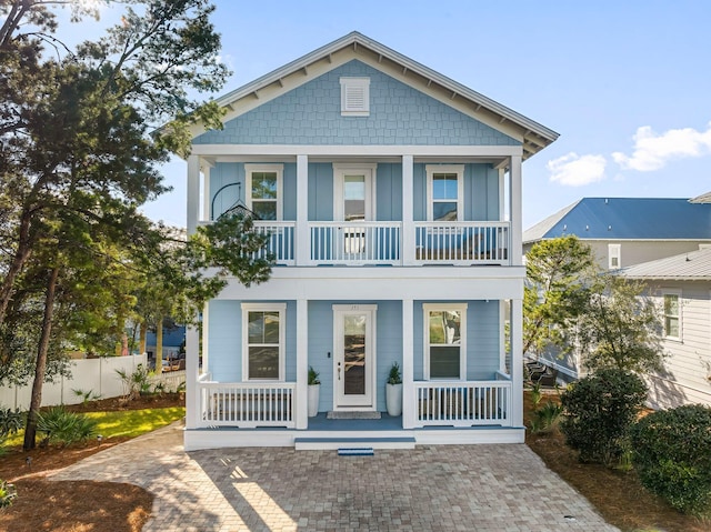 view of front of property with a porch and a balcony