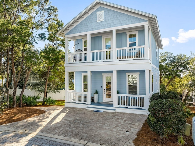 view of front of house featuring a balcony and a porch