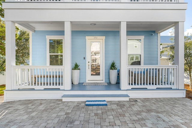 entrance to property featuring a porch