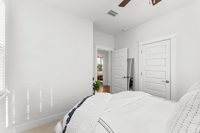 carpeted bedroom featuring ceiling fan