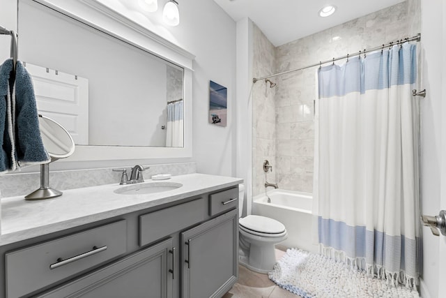 full bathroom featuring toilet, tile patterned flooring, shower / bath combination with curtain, and vanity