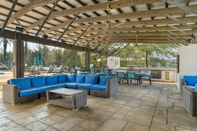 view of patio featuring an outdoor living space, a gazebo, and an outdoor kitchen