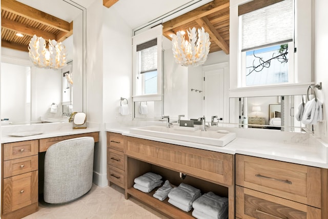 bathroom featuring vanity, an inviting chandelier, vaulted ceiling with beams, and wood ceiling