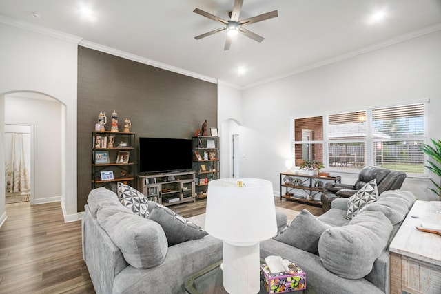 living room featuring ceiling fan, crown molding, and hardwood / wood-style flooring