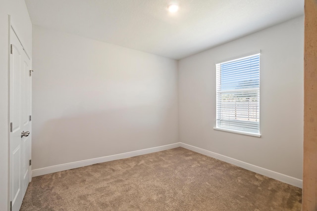 unfurnished room featuring carpet floors