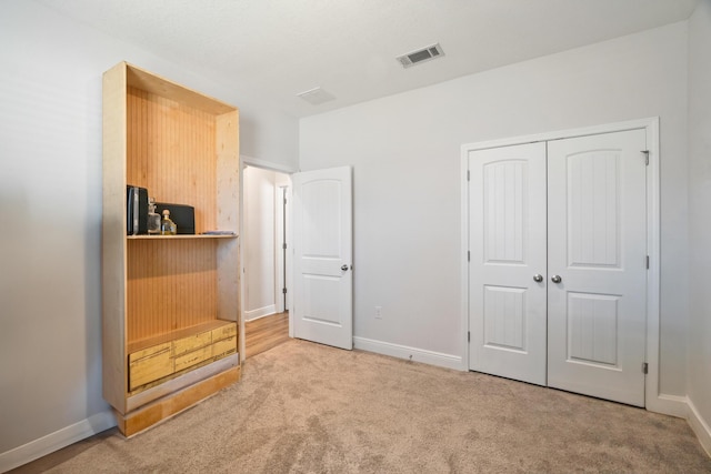 carpeted bedroom with a closet