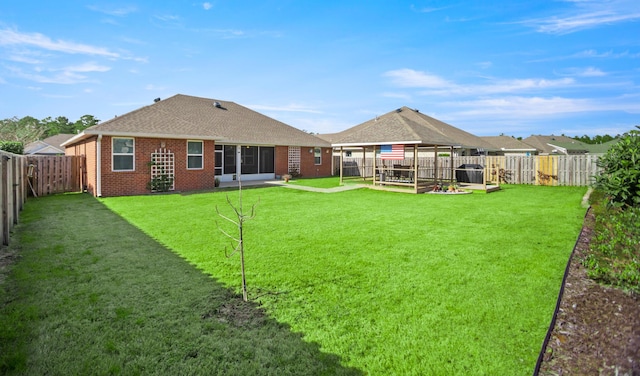 rear view of house with a yard