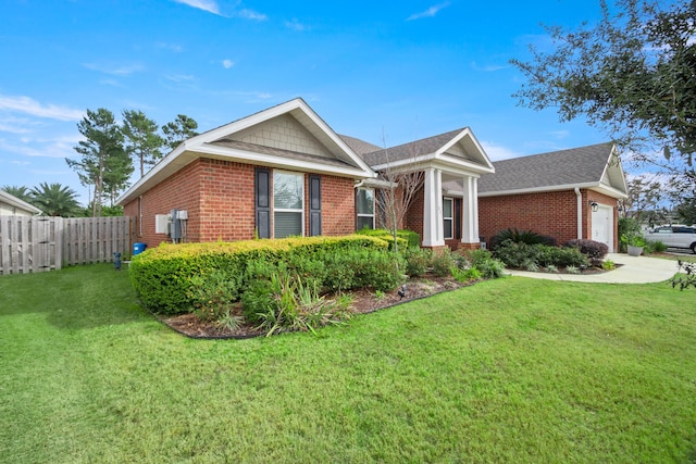 view of front of home with a garage and a front yard