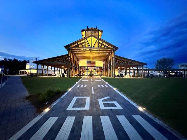 view of outdoor building at dusk