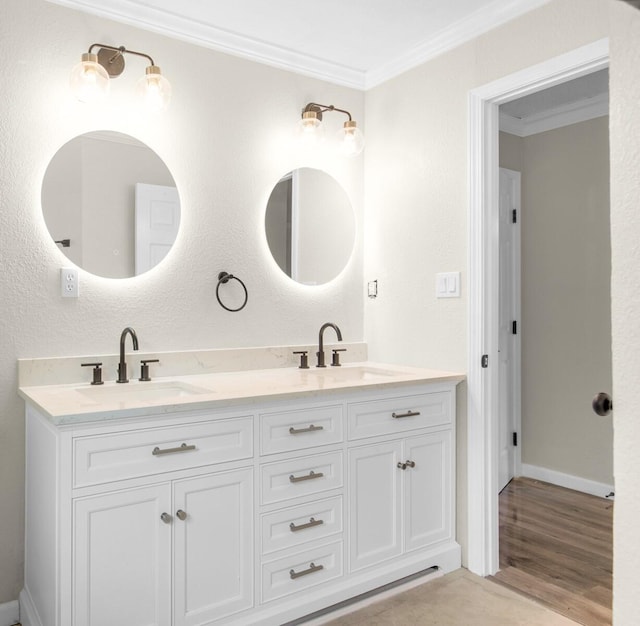 bathroom with hardwood / wood-style floors, vanity, and ornamental molding