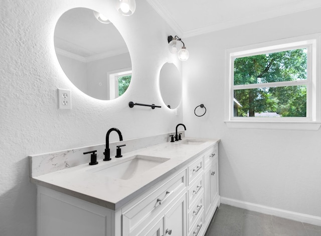 bathroom with crown molding and vanity