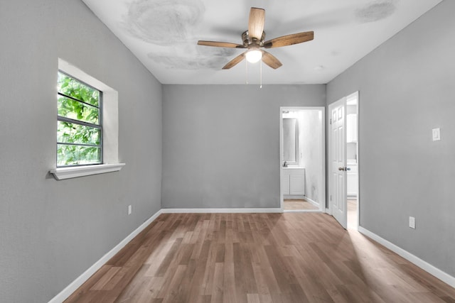 interior space with ceiling fan and hardwood / wood-style flooring