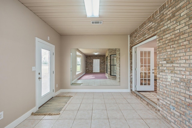 interior space featuring brick wall