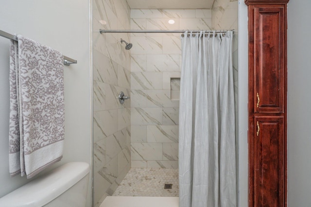 bathroom with toilet and curtained shower