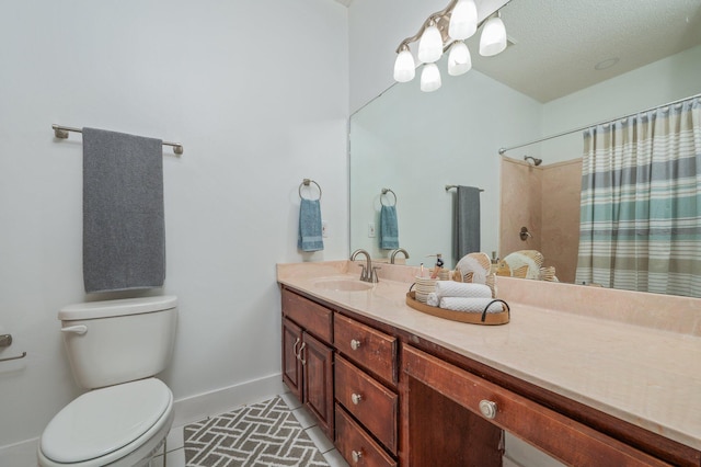 bathroom featuring toilet, vanity, and walk in shower