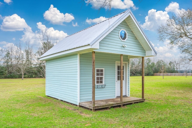 view of outbuilding with a lawn