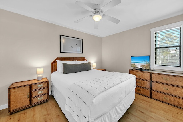 bedroom with light hardwood / wood-style flooring and ceiling fan