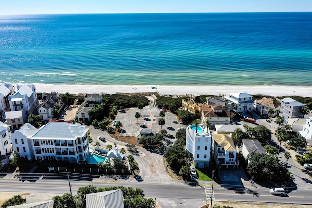 bird's eye view featuring a view of the beach and a water view