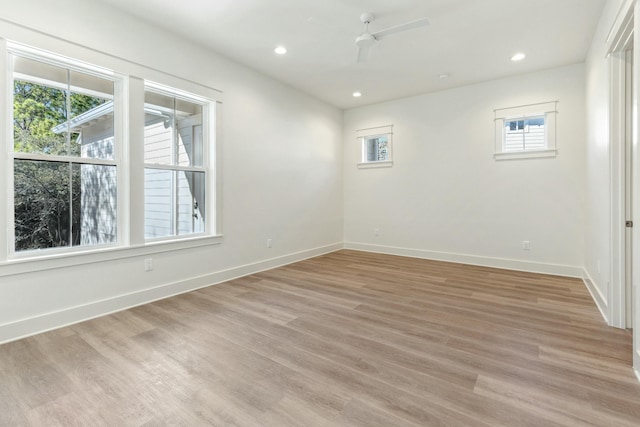 unfurnished room featuring ceiling fan and light hardwood / wood-style flooring