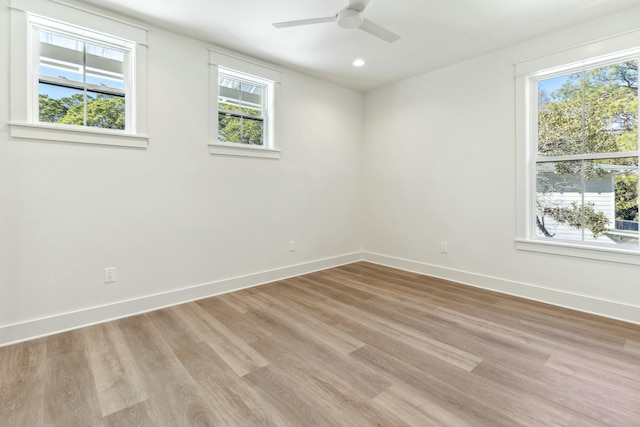 unfurnished room featuring ceiling fan and light wood-type flooring