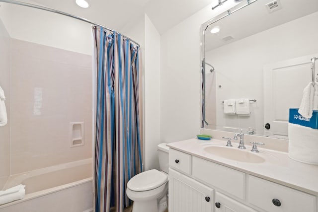 full bathroom with toilet, vanity, and shower / tub combo with curtain