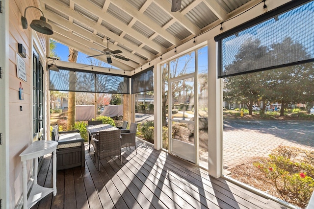 sunroom / solarium with ceiling fan and a healthy amount of sunlight