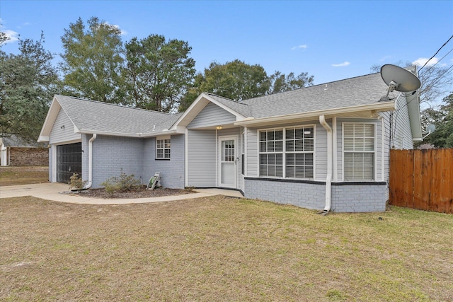 ranch-style house with a front yard and a garage