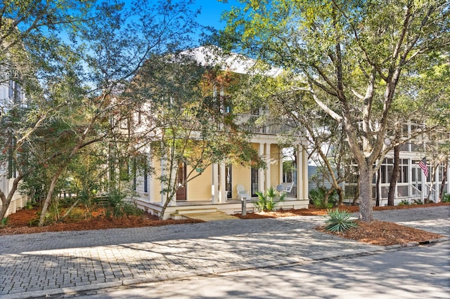 view of front of home with a sunroom