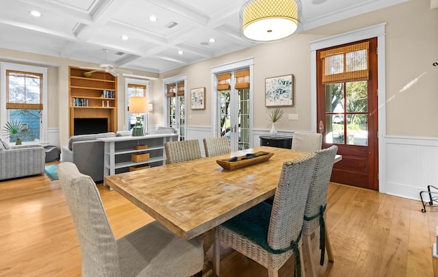 dining area with french doors, beamed ceiling, light hardwood / wood-style floors, built in features, and coffered ceiling