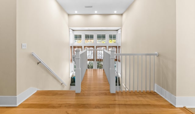 corridor with wood-type flooring